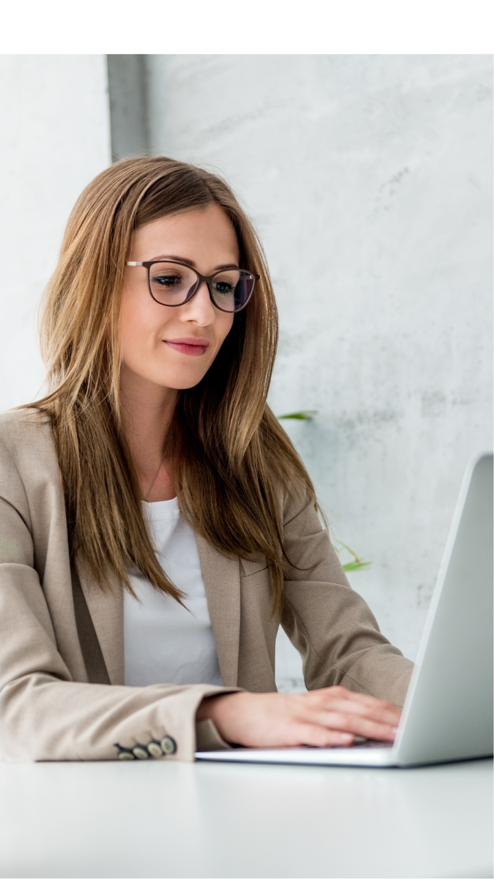 Business professional reviewing corporate compliance documents in a modern office.
