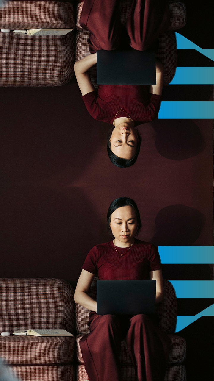 Woman working on a laptop in a modern office, representing human-centric cybersecurity awareness and workplace security behaviour. Article 3 - Are your people the…